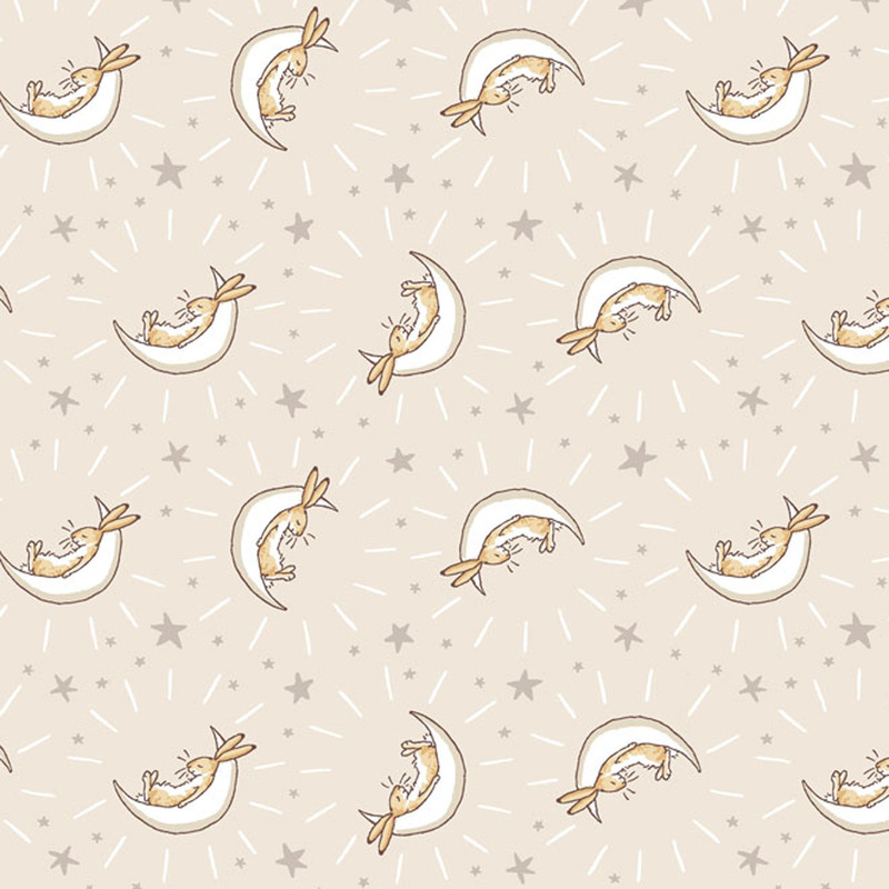 Khaki fabric featuring stars and bunnies cradled in cream crescent moons.