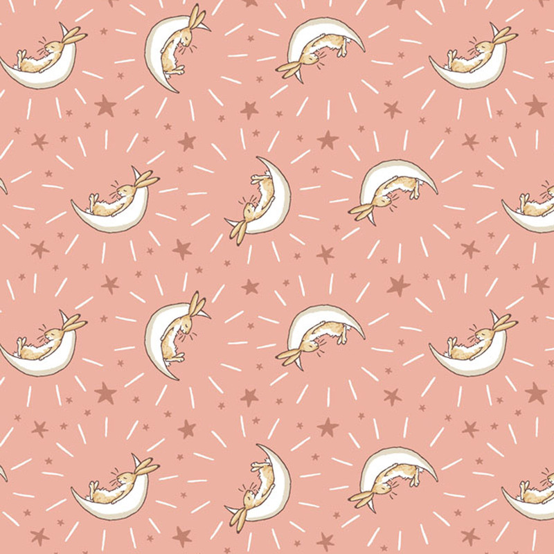 Coral fabric featuring stars and bunnies cradled in cream crescent moons.