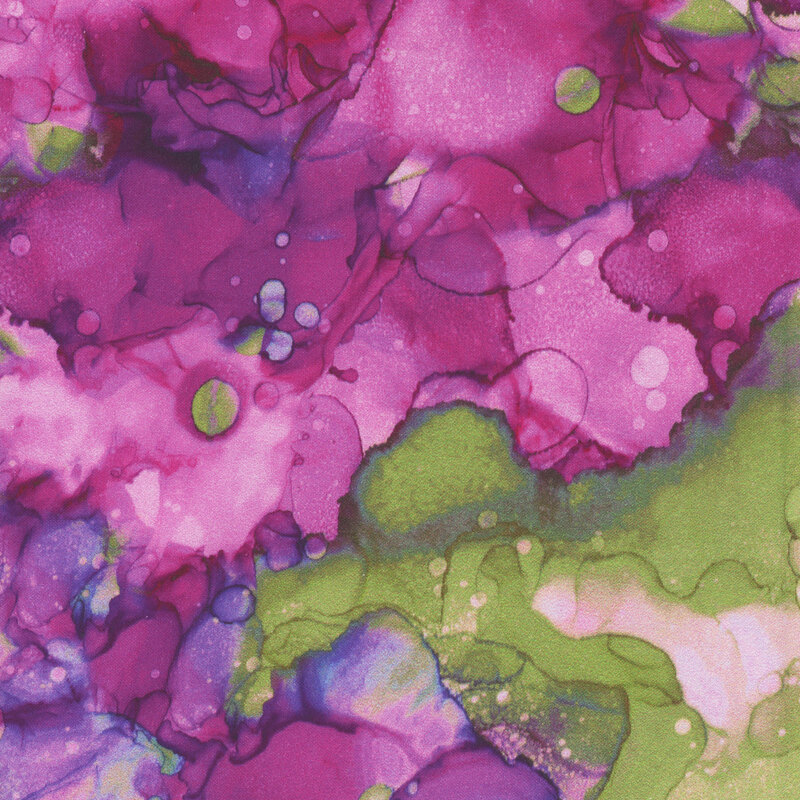 A watercolor print in shades of purple and magenta with a splash of green.