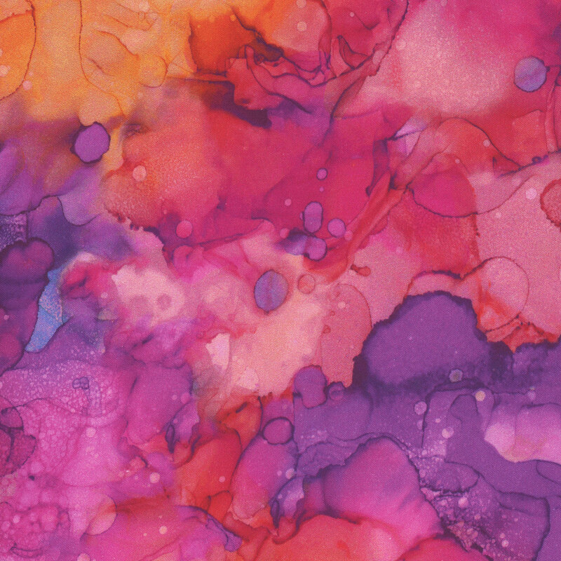 A watercolor print in shades of pink and purple with a splash of orange.