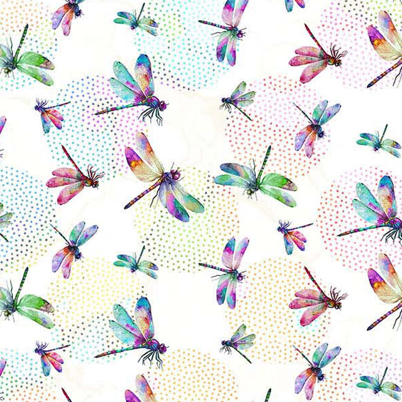 White fabric with large round shapes made up of multicolored dots in the background of multicolored dragonflies in various sizes tossed all over.