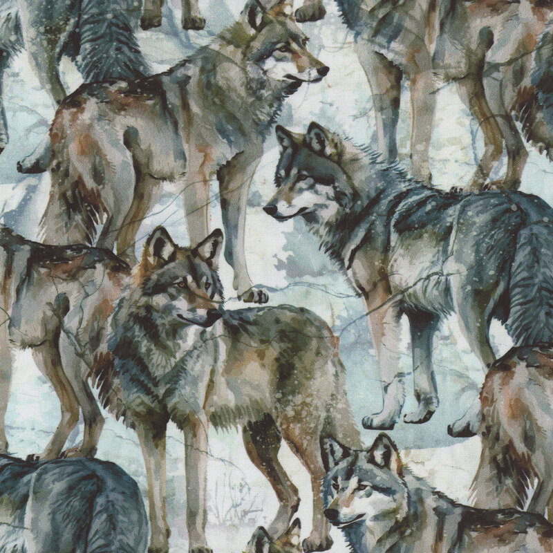 lovely fabric featuring packed together wolves over faded forest brush, all done in gorgeous watercolor styling