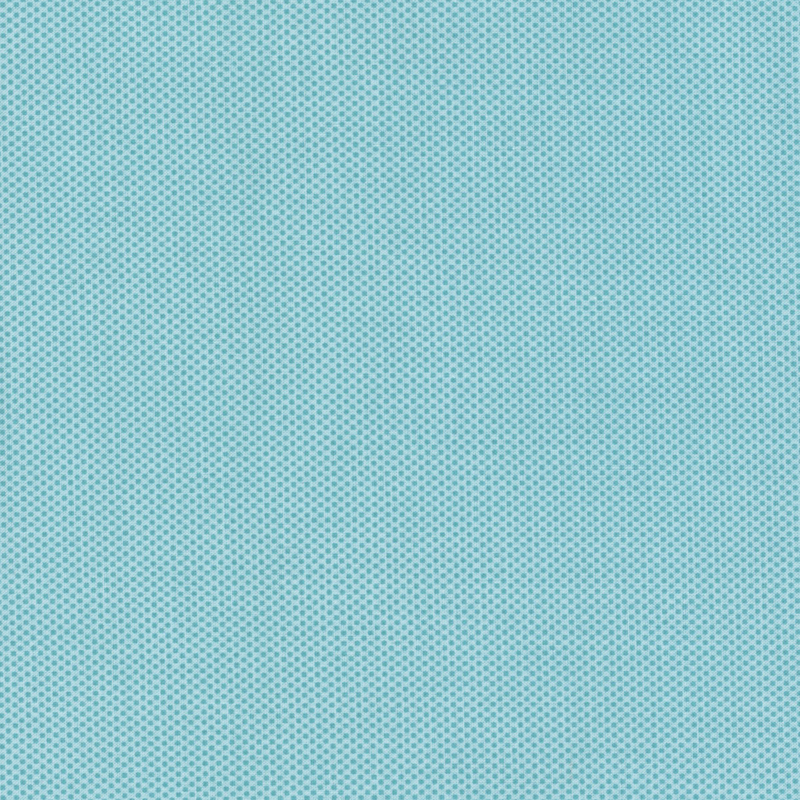 aqua fabric featuring a dotted halftone tonal print