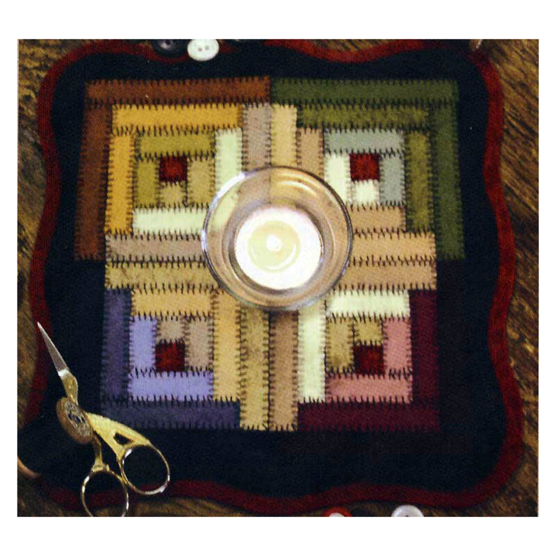 photo of log cabin candle mat featuring a block design with a hand sewn look