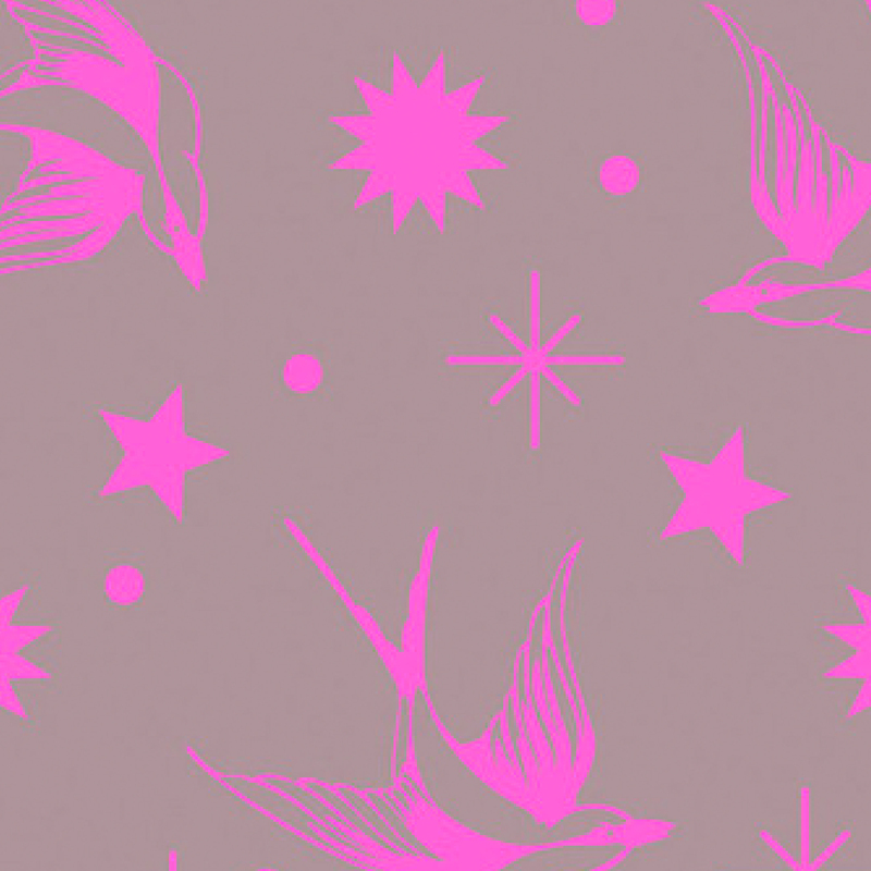 gorgeous warm gray fabric with neon pink swallows, stars, and other large sparkle motifs scattered across