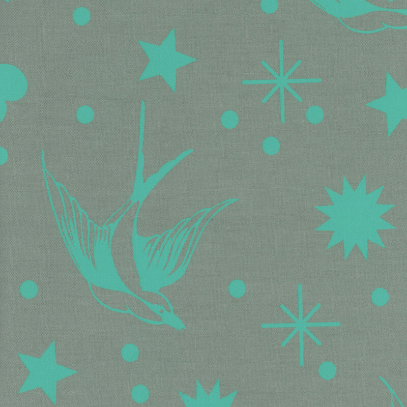 gorgeous cool gray fabric with neon teal swallows, stars, and other large sparkle motifs scattered across