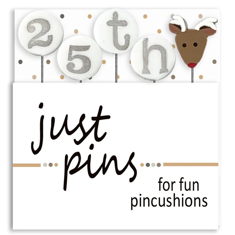 A digital mockup of the packaging for the pins, showing a reindeer pin and four pins that spell out 25th.