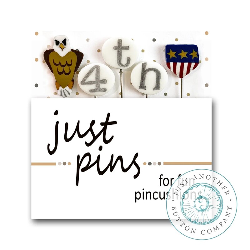A digital mockup of the packaging edited with the real pins, showing an eagle, a badge, and the letters and number to spell 