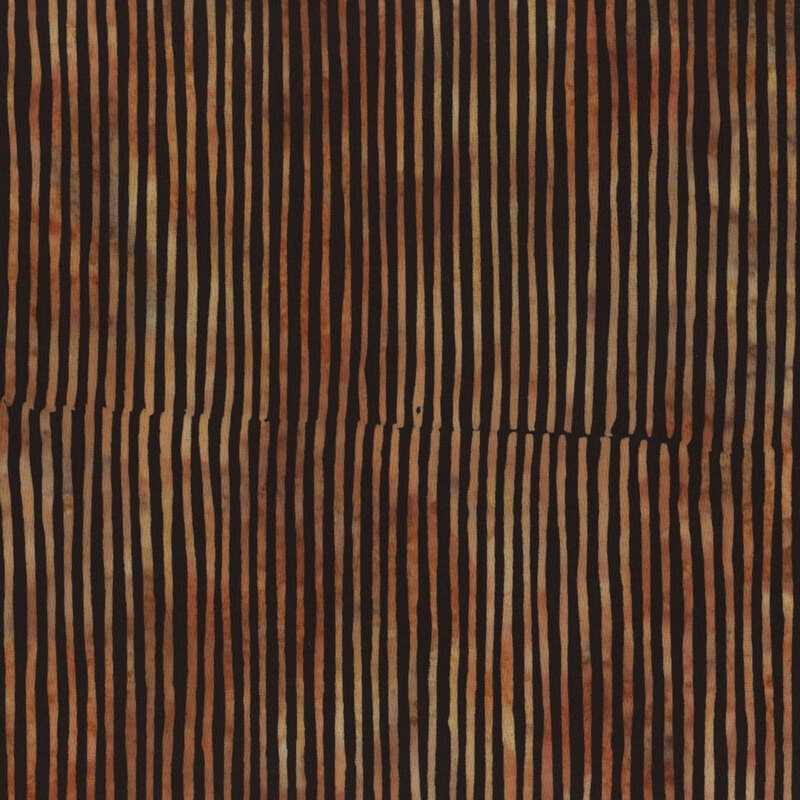 gorgeous black batik fabric featuring thin mottled brown and tan stripes