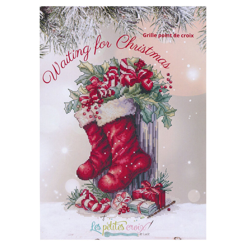 Front of pattern showing a digitized version of the finished project, featuring Christmas stockings hanging on a tree trunk with leaves, berries, and presents