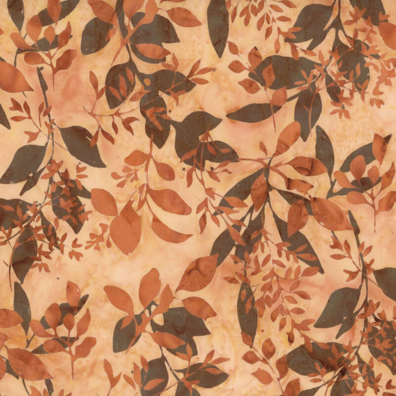 stunning orange mottled batik fabric featuring scattered dark brown and orange mottled leaf sprigs