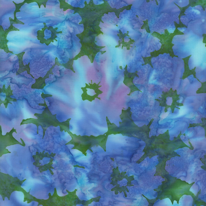lovely green mottled batik fabric featuring scattered flowers with aqua, blue, and purple mottling