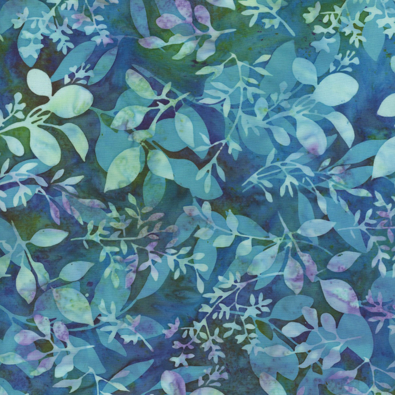 gorgeous blue and green mottled batik fabric featuring overlapping purple, aqua, and green mottled leaf sprigs