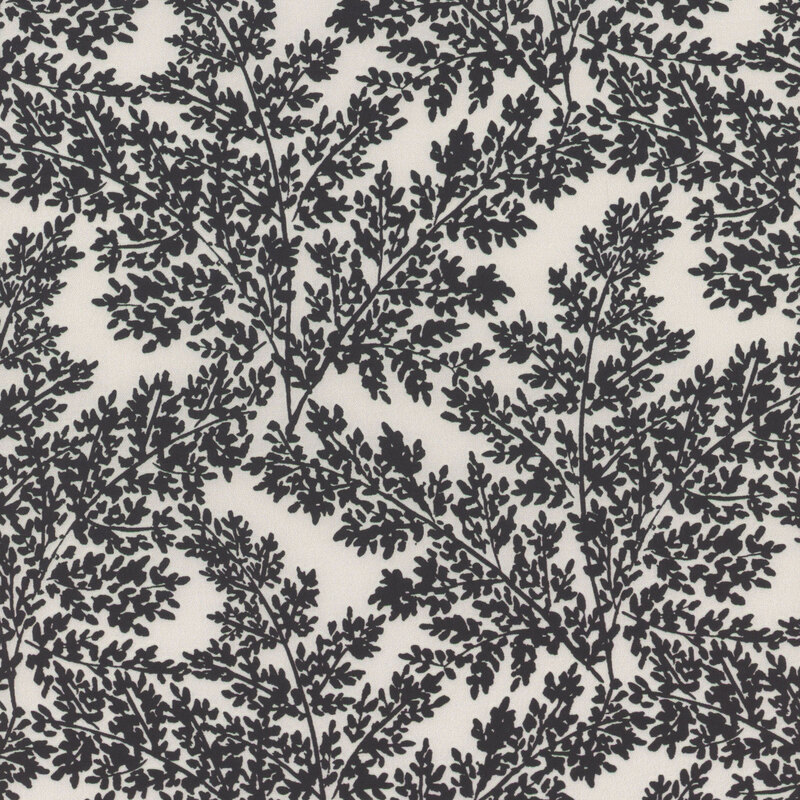Cream-colored fabric patterned with black leafy branches.