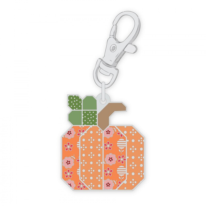 Digital mockup of the enamel pin with a clip: an orange pumpkin that has lots of texture and tiny details.