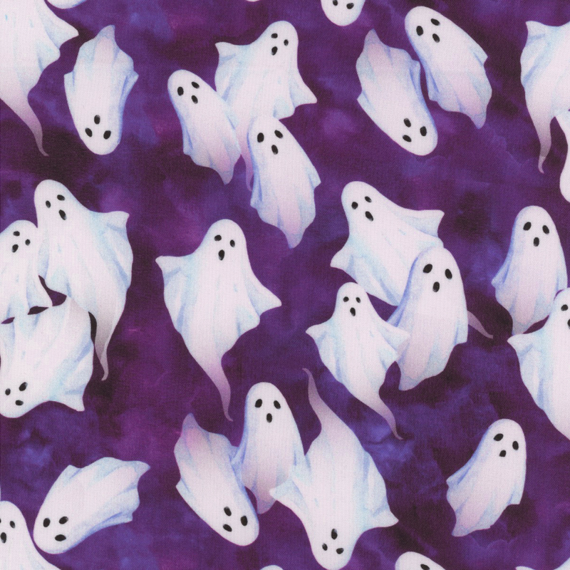 Mottled purple fabric with little white ghosts all over.