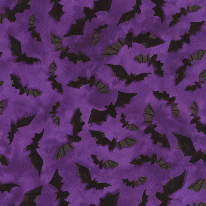 Mottled purple fabric with little black bats all over.