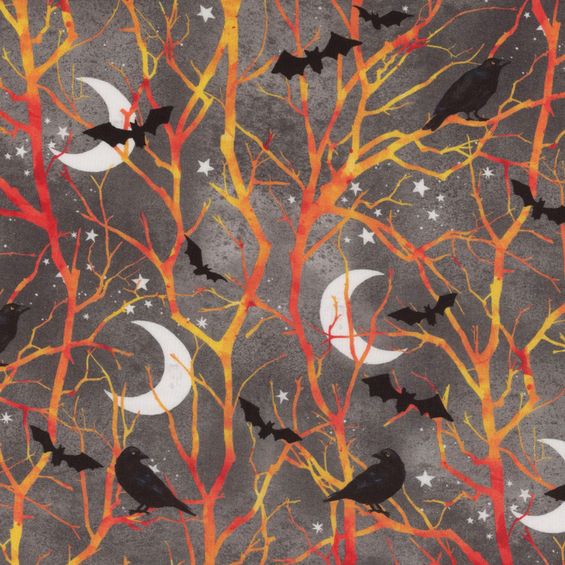 Mottled gray fabric with bare tree branches with little black bats, crows, crescent moons, and stars.
