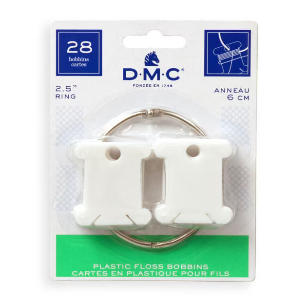 A pack of DMC Plastic Bobbins on a white background