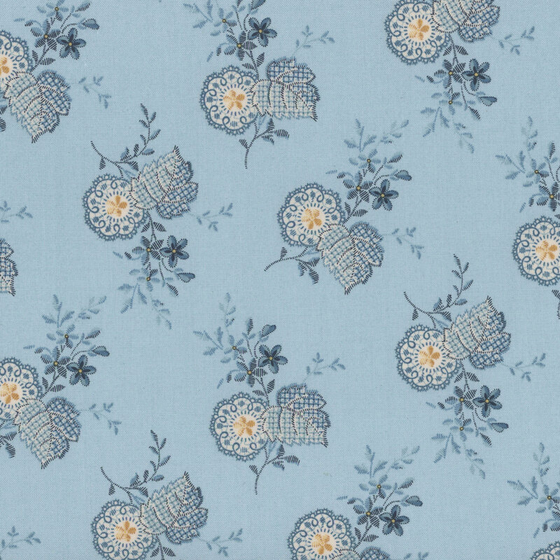 Light blue fabric featuring blue and white paisley flowers with yellow accents.