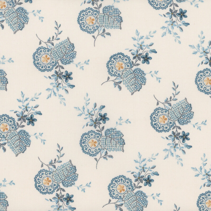 Cream-colored fabric featuring blue and white paisley flowers with yellow accents.