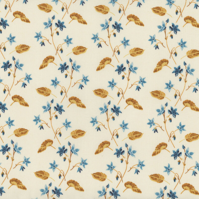 Cream-colored fabric with little blue flowers and yellow-gold leaves.