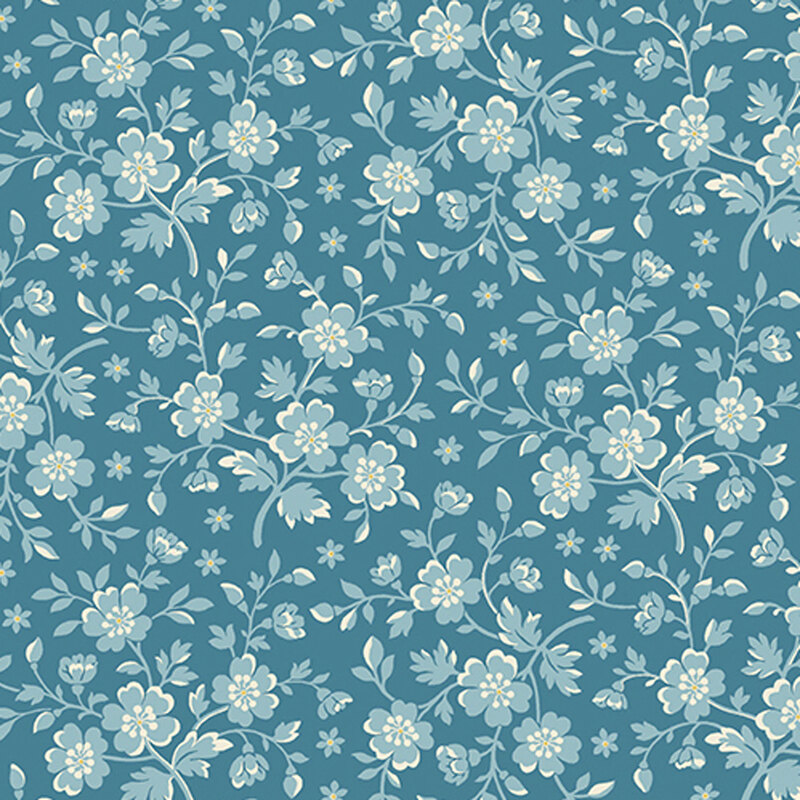 Blue fabric with light blue flowers and leaves with yellow accents.