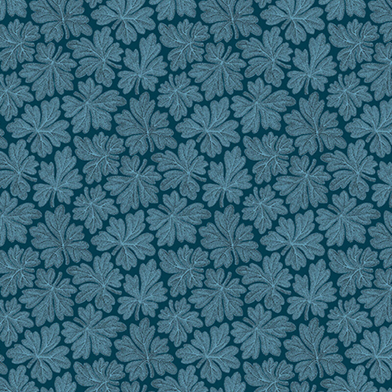 Blue leaves arranged on deep blue fabric.
