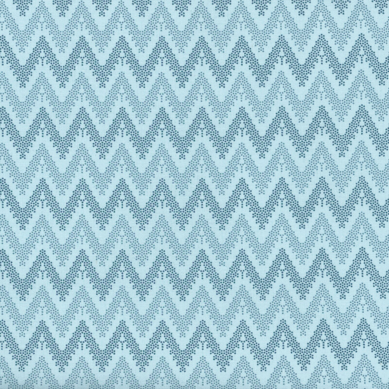 Blue fabric with dotted chevron stripes of blue and navy.