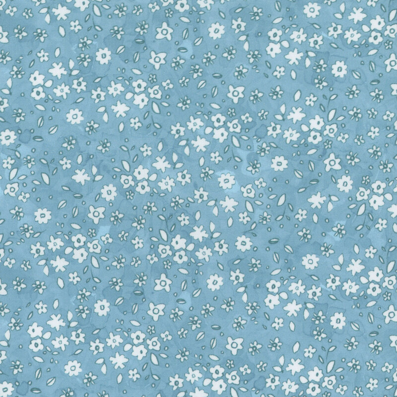 Aqua fabric with a pattern of little white watercolor flowers.