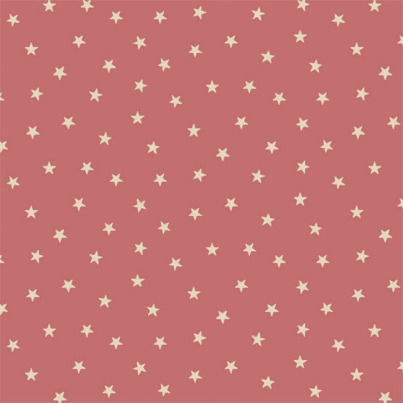 Blush pink fabric with a pattern of tiny stars in a row