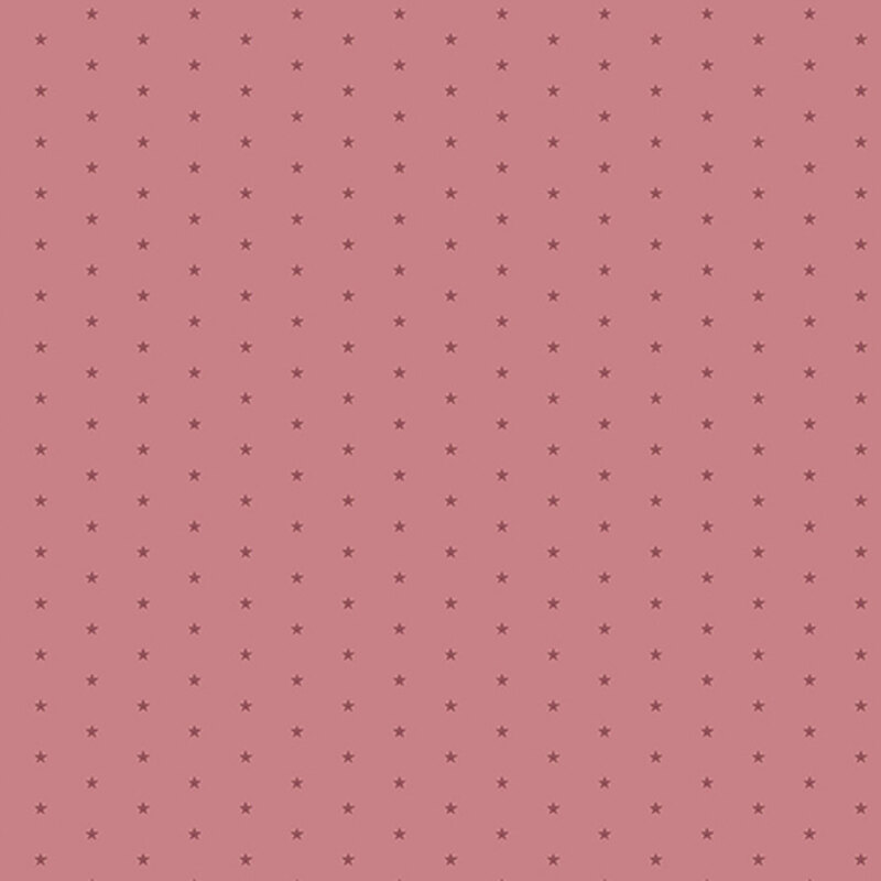 Mauve pink fabric with a pattern of tiny stars in a row
