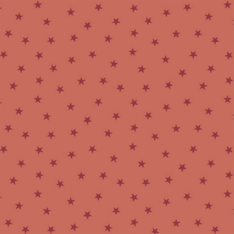 Coral orange fabric with a pattern of tiny stars in a row