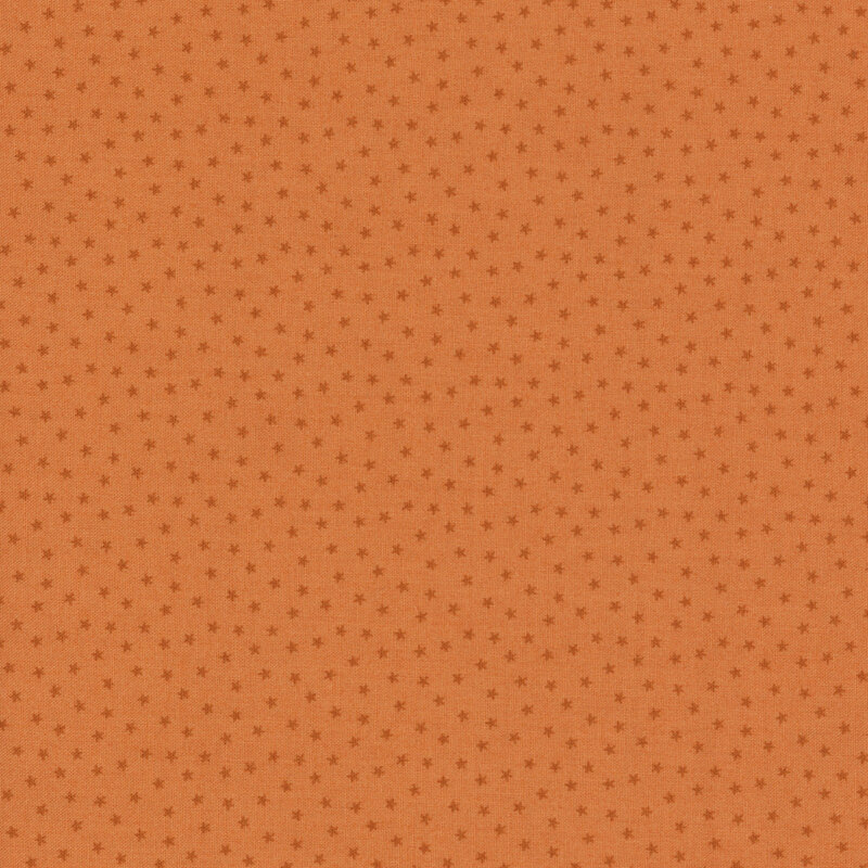 orange fabric with a pattern of tiny stars in a row
