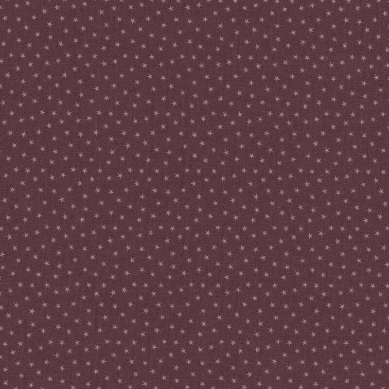 Mauve taupe fabric with a pattern of tiny stars in a row