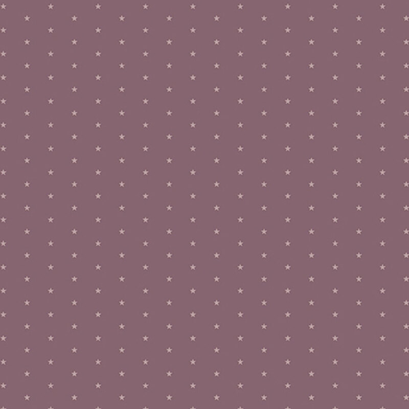 Mauve fabric with a pattern of tiny stars in a row