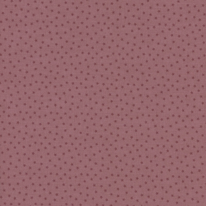 Light mauve fabric with a pattern of tiny stars in a row