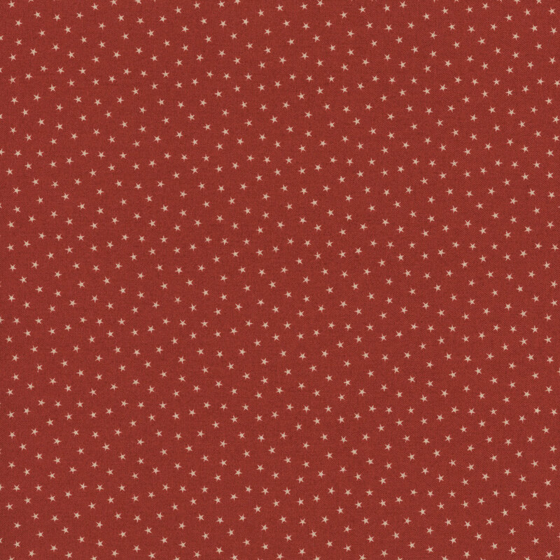 Cherry red fabric with a pattern of tiny stars in a row