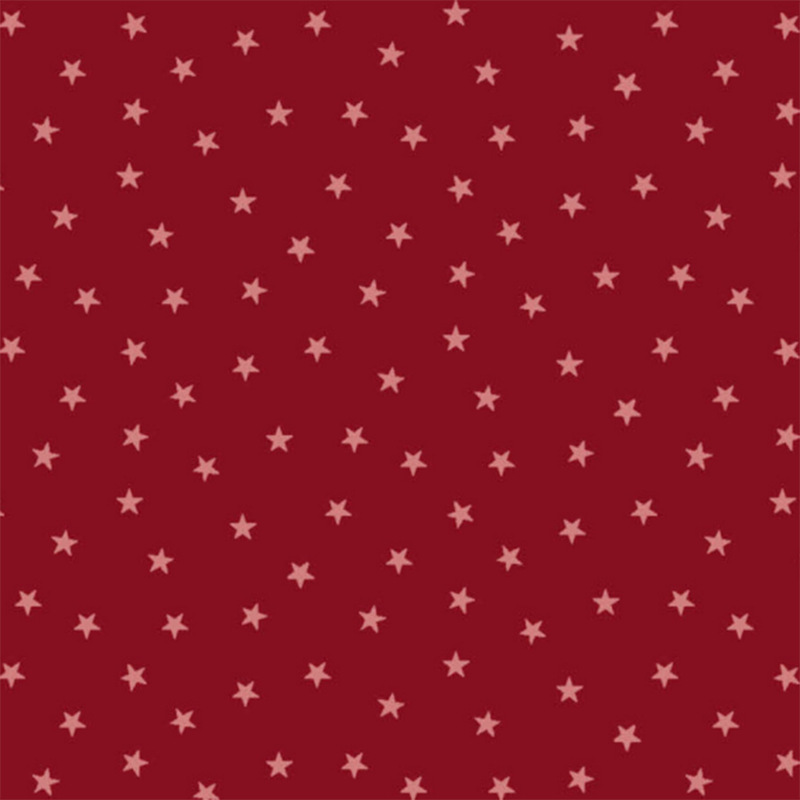 Ruby red fabric with a pattern of tiny stars in a row