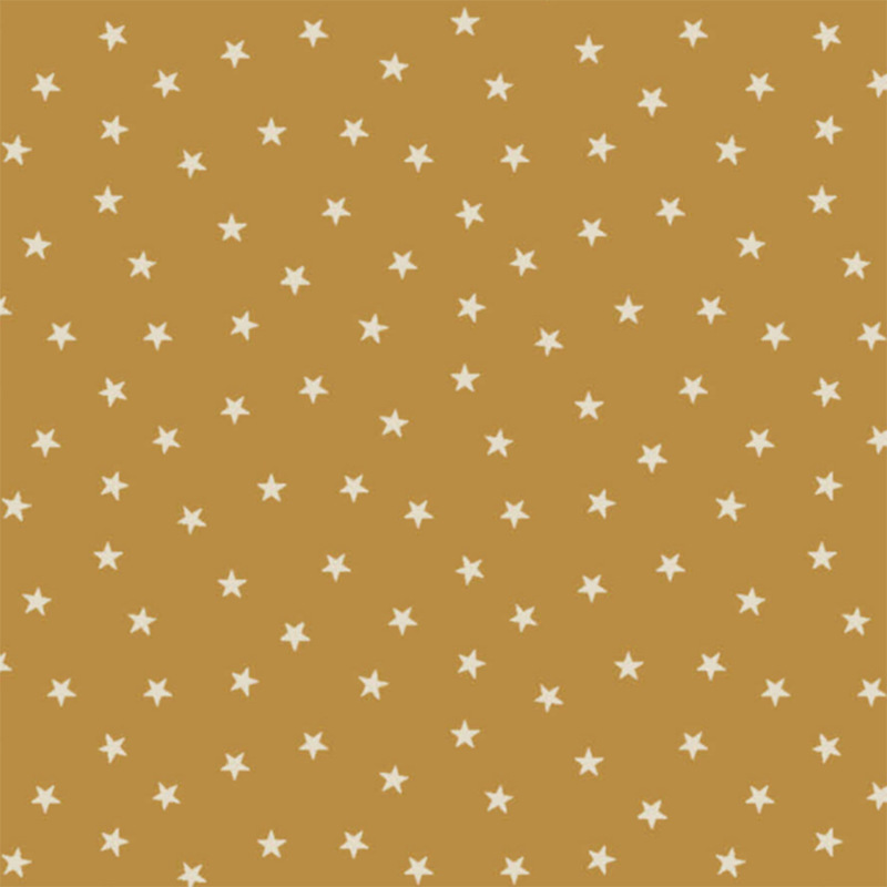 Honey yellow fabric with a pattern of tiny stars in a row