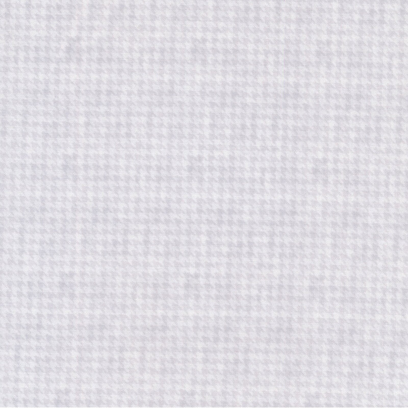 white and gray fabric with a houndstooth pattern