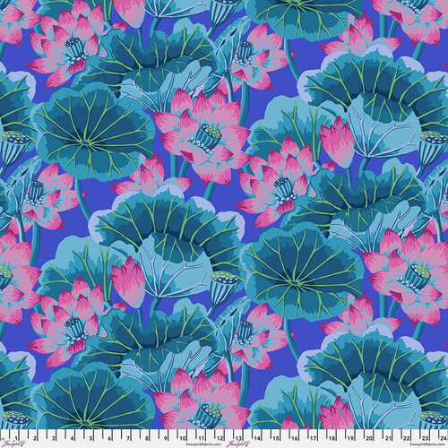 Fabric with bright teal lotus pods and lily pads with magenta lotus flowers on an indigo background.