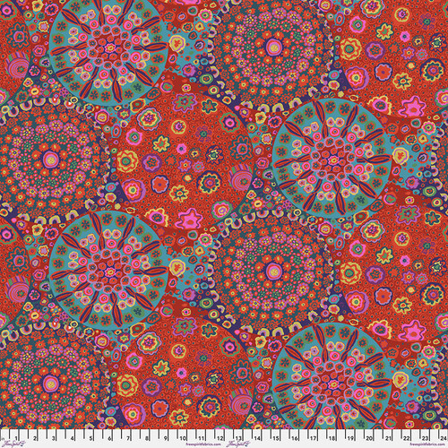  Fabric featuring vibrant multicolor kaleidoscopic abstract designs, gathered into large medallions.