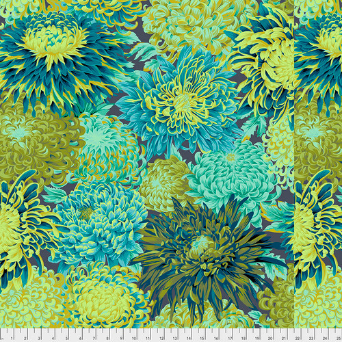 Fabric featuring vibrant green, blue, and teal chrysanthemums over a warm gray background