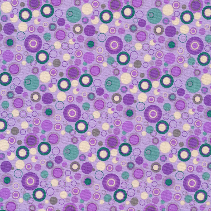 purple fabric with dots that look like bubbles in gray, teal, white and shades of purple
