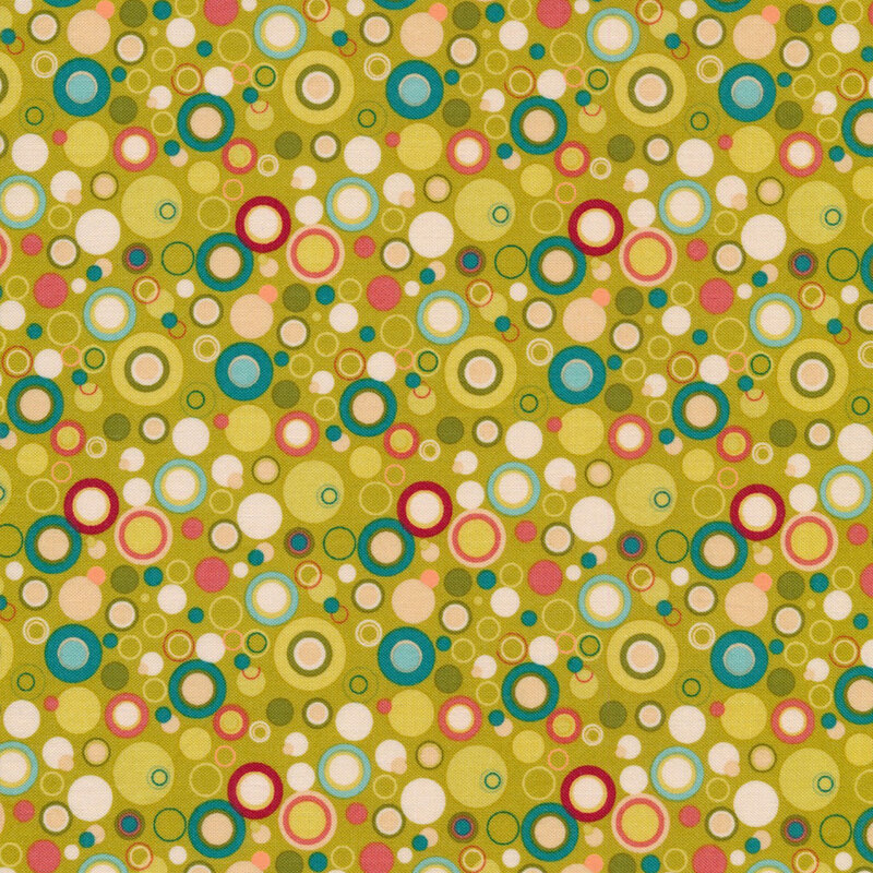 Chartreuse green fabric with dots that look like bubbles in red, white, and shades of pink, blue, and green
