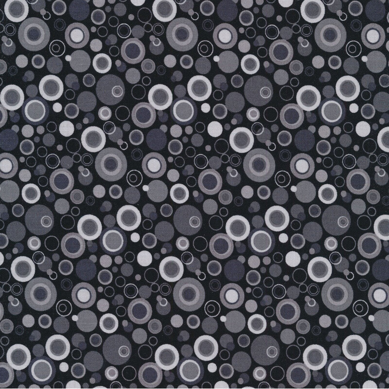 Black fabric with dots that look like bubbles in shades of gray
