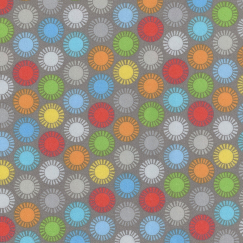 gray fabric featuring colorful suns