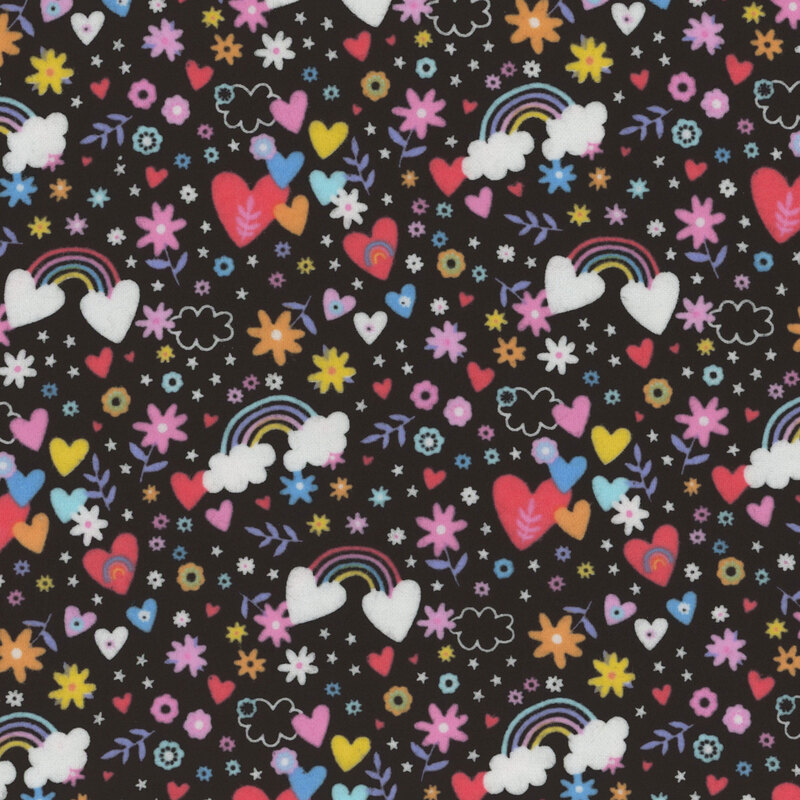 black fabric featuring rainbows, flowers, and hearts 
