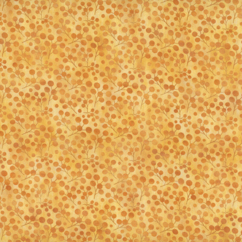 This fabric features golden tonal berries mottled with the golden yellow background.